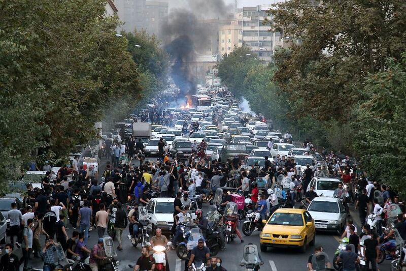 People clash with police during a protest following the death of Mahsa Amini, in Tehran, Iran, in September 2022. Amini, a 22-year-old Iranian woman, had been arrested in Tehran that month by morality police, a unit responsible for enforcing Iran's strict dress code for women. Photograph: EPA