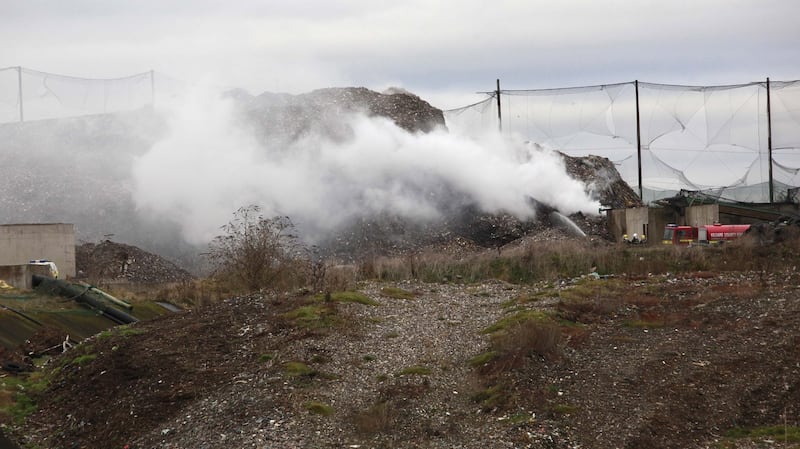 Fire fighters from Kildare Fire Station are seen trying to control an underground fire at the landfill site at Kerdiffstown in 2011. Photograph: Brenda Fitzsimons/The Irish Times