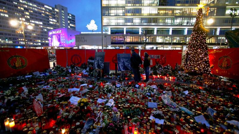 Flowers and candles at the former Christmas market at Breitscheid square in Berlin, Germany following the attack in December which killed 12. Photograph: Hannibal Hanschke/Reuters