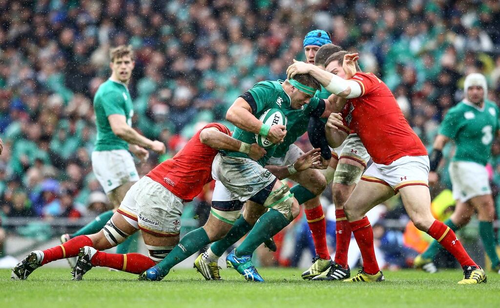 Ireland’s CJ Stander is tackled by Taulupe Faletau and Gethin Jenkins of Wales during the Six Nations game at the Aviva Stadium. Photograph: James Cromie/Inpho