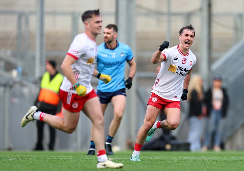 Tyrone’s Ruairí and Darragh Canavan celebrate a late point at Croke Park. Dublin could muster no reply. Photograph: James Crombie/Inpho