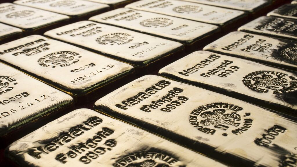 Gold ticked up after an eight-day losing streak on Monday, but languished near its lowest in three months.