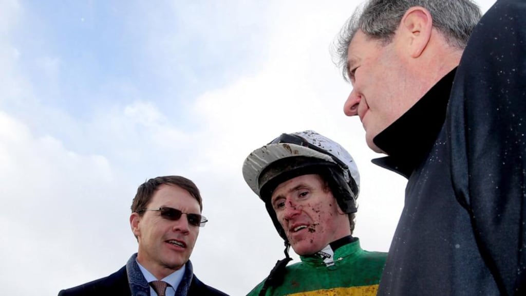 Winning racehorse trainer Aidan O’Brien speaks to jockey Tony McCoy and owner JP McManus after claiming an opening race of the Leopardstown Christmas Festival with Plinth. Photograph: James Crombie/Inpho