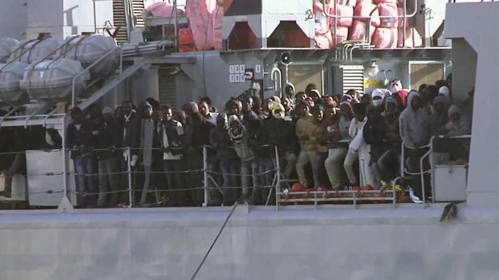 Migrants on board an Italian navy vessel as it cruises towards the Italian port of Messina on Saturday. Photograph: AP