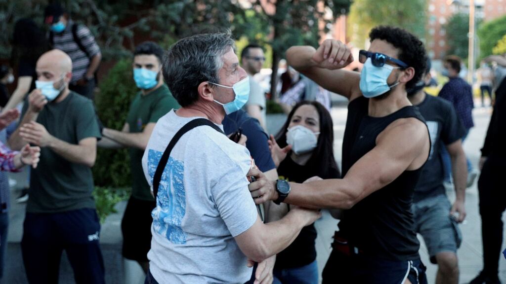 Protesters and counter-protesters clash during a march against the Spanish central government’s management of the coronavirus crisis in Madrid, Spain. Photograph: EPA/Rodrigo Jimenez