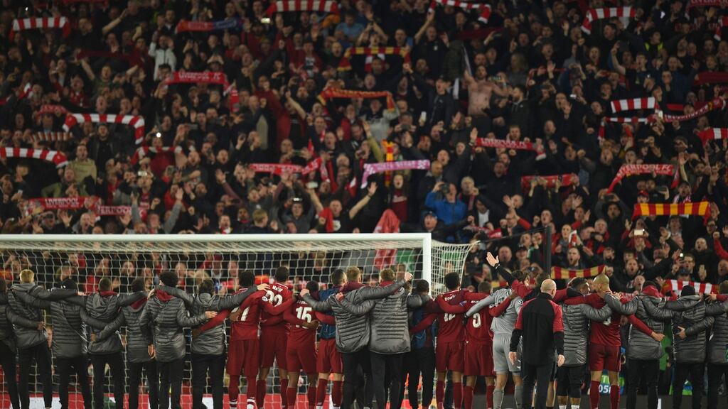 Liverpool players celebrate in front of the Kop after beating Barcelona in the Uefa Champions League semi-final. Photo: Oli Scarff/Getty Images