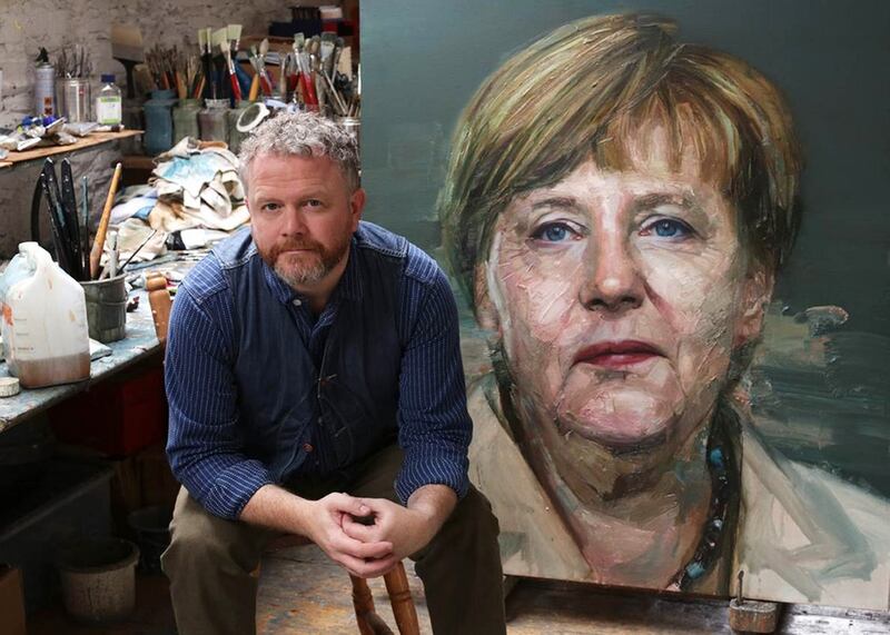 Colin Davidson with his painting of Angela Merkel which made the front cover of Time magazine.