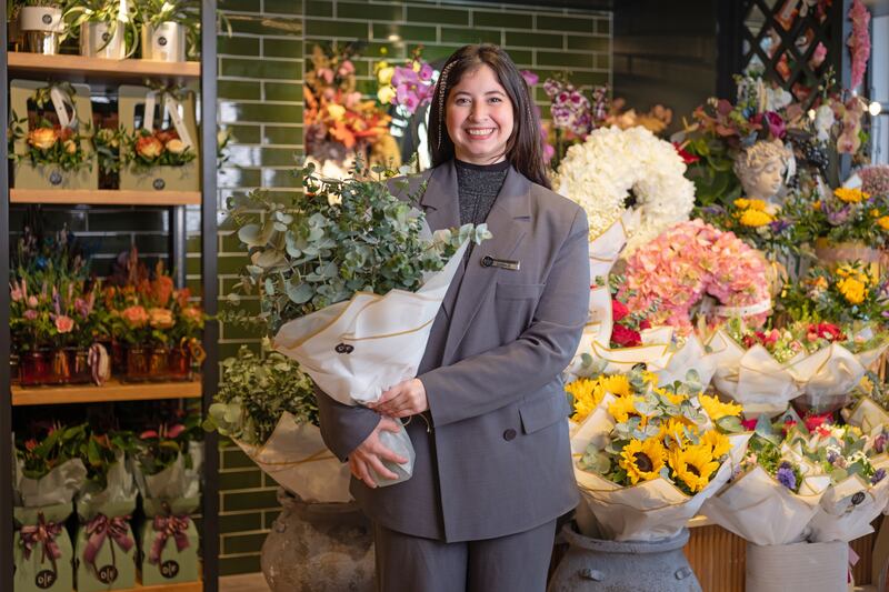 Florist Camila Alejandra Rivero with fresh eucalyptus, a customer favourite