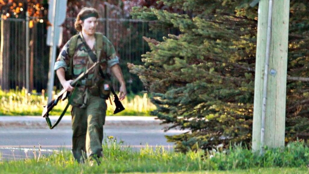 A heavily armed man identified by police in moncton, Canada as Justin Bourque has been arrested in connection with the deaths of three and wounding of two police officers in the New Brunswick province. Photograph: Viktor Pivovarov/Times & Transcript/telegraphjournal/Reuters.