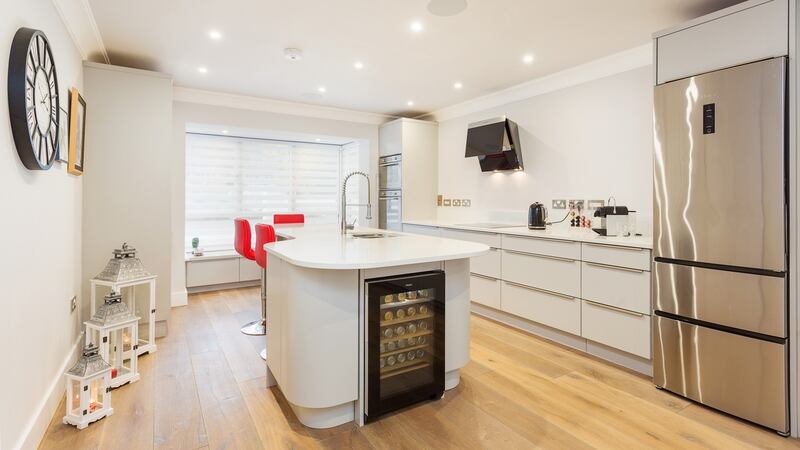 Custom-built kitchen with   large island and breakfast bar