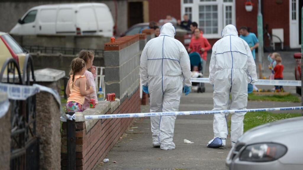 Gardaí in Croftwood Gardens, Cherry Orchard, Dublin, where a six-year-old was shot on Friday. Photograph: Dara Mac Dónaill.