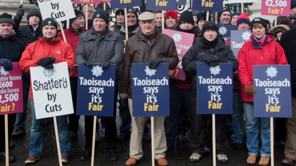 Members of the Garda Representative Association protest outside Government Buildings yesterday over proposed public service cuts. Photograph: Gareth Chaney/Collins
