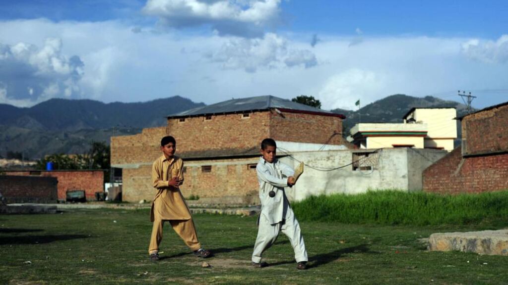 Children play near the final hideout of Osama bin Laden in Abbottabad. Photograph: Asif Hassan/AFP