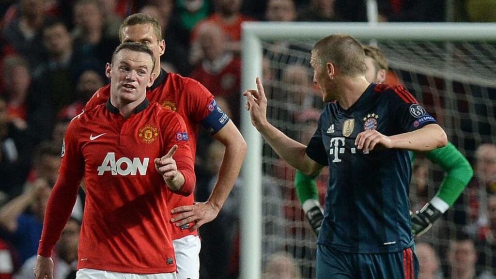 Bayern Munich’s Bastian Schweinsteiger (right) arguing with Manchester United’s Wayne Rooney after receiving a red card at Old Trafford. Photograph: Martin Rickett/PA Wire