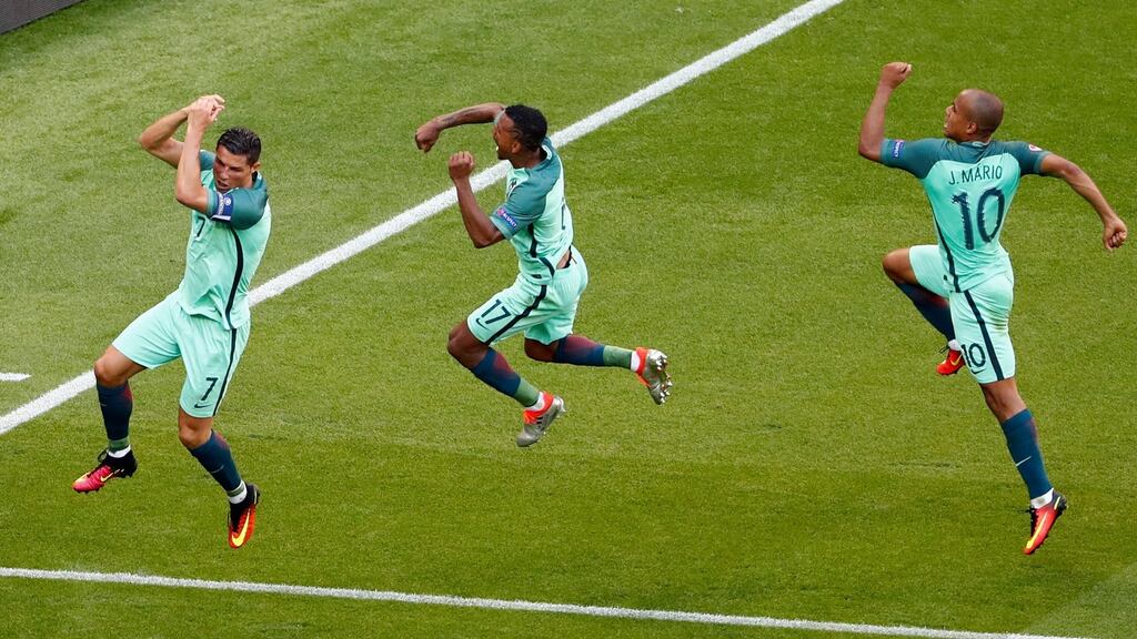 Portugal’s Cristiano Ronaldo celebrates with Nani and Joao Mario after scoring their second goal. Photo: Max Rossi/Reuters