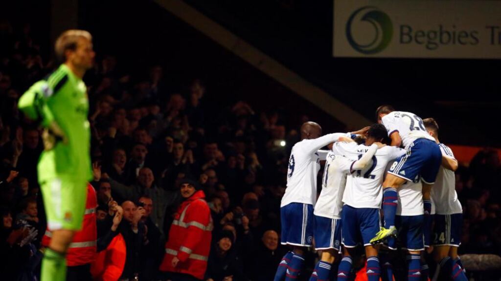 Jussi Jaaskelainen looks on as Chelsea’s  players celebrate with Frank Lampard. Photograph: Tal Cohen/EPA