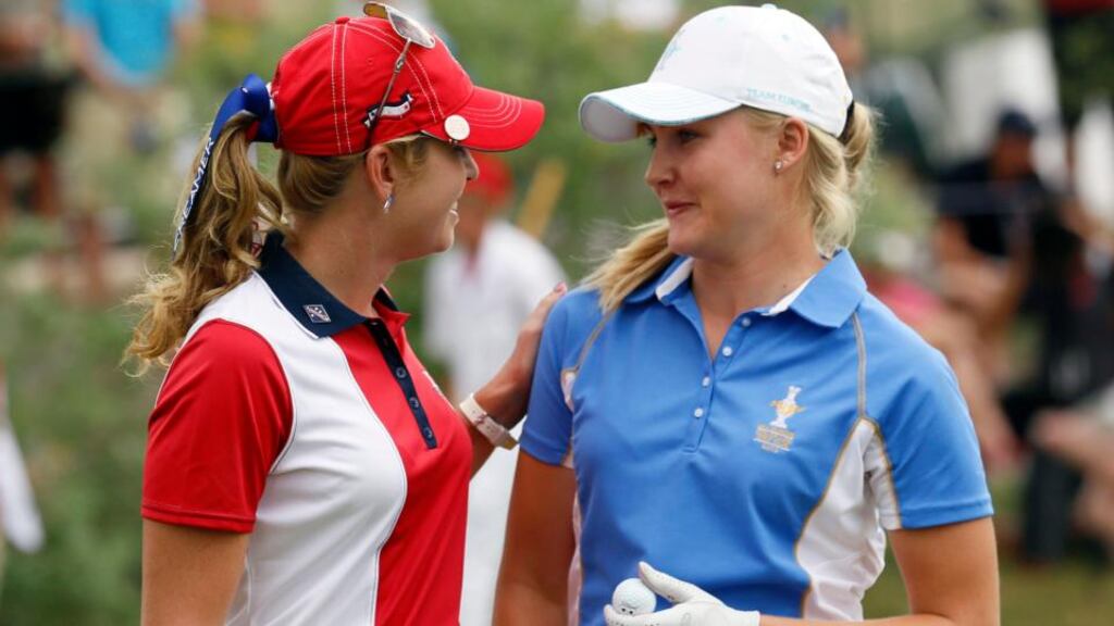 Charley Hull asks Paula Creamer to sign her ball after defeating the American 5 and 4 in their singles match. Photograph: Rick Wilking/Reuters