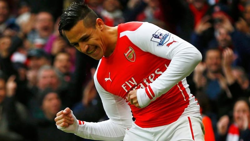 Arsenal’s Alexis Sanchez celebrates after scoring his second goal against Stoke City at Emirates Stadium. Photograph: Eddie Keogh / Reuters
