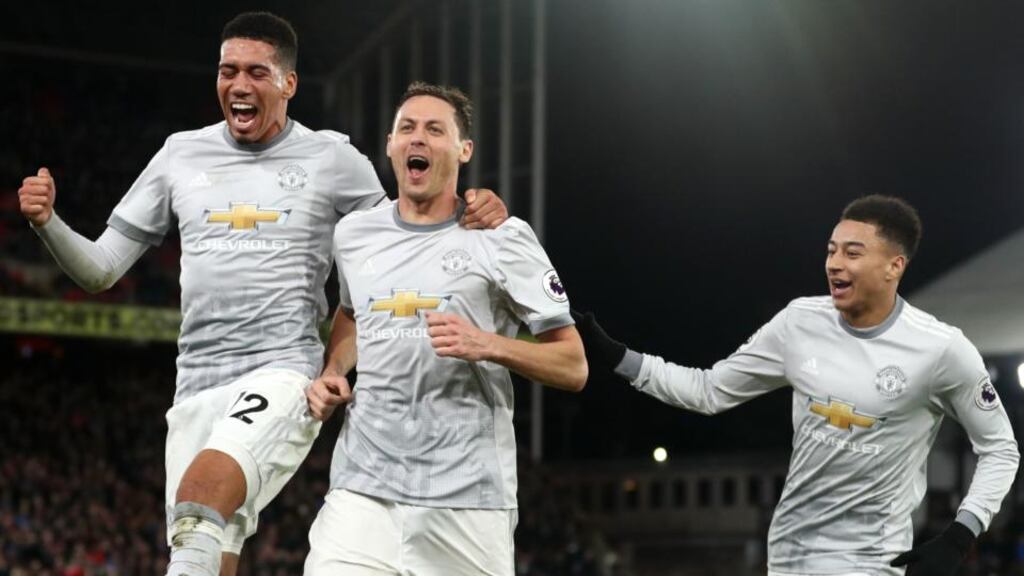 Manchester United’s Chris Smalling, Nemanja Matic and Jesse Lingard celebrate staging a comeback against Crystal Palace. Photograph: Catherine Ivill/Getty Images