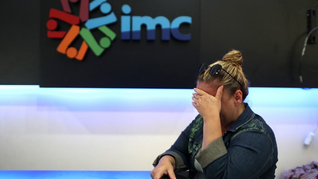 A worker of private Turkish television IMC TV cries after police closed the channel at the station headquarters in Istanbul, Turkey. Photograph: Sedat Suna/EPA