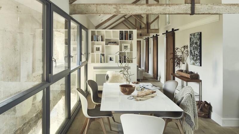 The architect’s design involved the insertion of a modern, well-insulated and simply-finished “box” within the old walls.