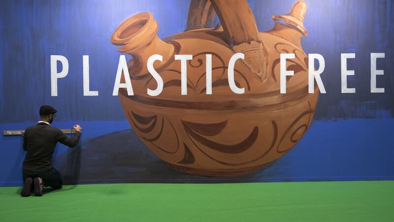 Artist Jonatan Carranza Ojo makes a mural showing a ‘botijo’ (ceramic pot) on the second day of the COP25 climate conference in Madrid. Photograph: Pablo Blazquez Dominguez/Getty