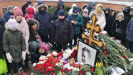 Alexei Navalny supporters visit grave on first anniversary of his death