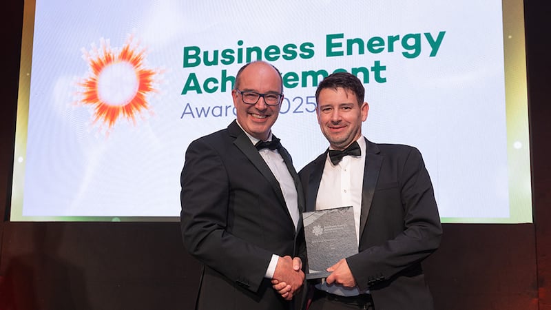 Xavier Dubuisson, awards judge, presents the best energy achievement in construction to Ian O'Connor, Sisk
