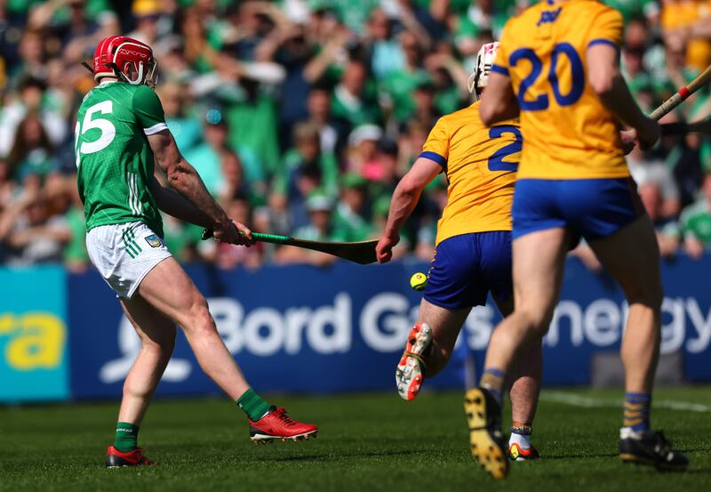 Limerick’s Donnacha Ó Dálaigh scores his side's third goal against Clare at Cusack Park. Photograph: James Crombie/Inpho
