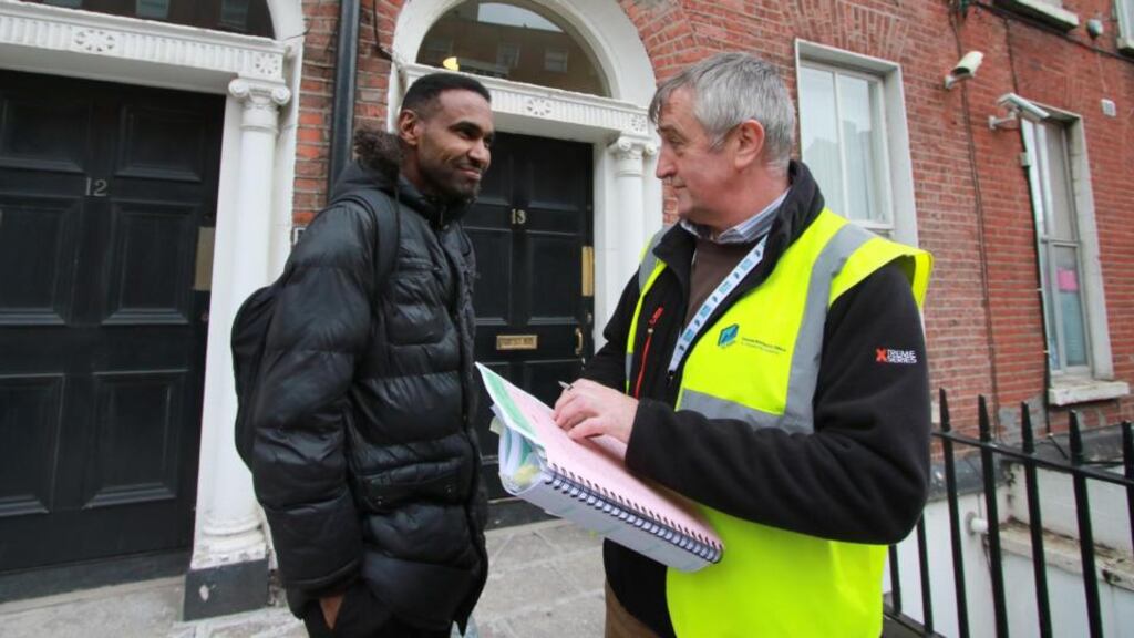 On the doorsteps: census enumerator Ciarán Lynam with local resident Ahmed Atiya. Photograph: Nick Bradshaw