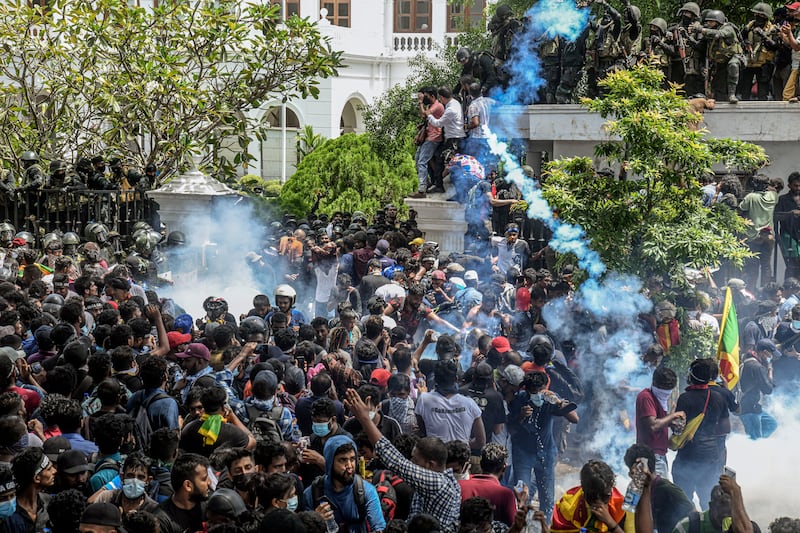 Protesters storm the building housing the office of Ranil Wickremesinghe in Colombo, Sri Lanka. Photograph: Atul Loke/The New York Times