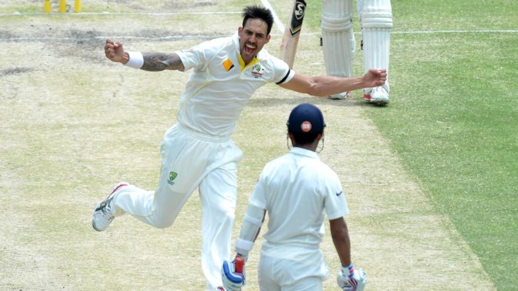Australia’s Mitchell Johnson celebrates taking the wicket of Indian batsman Ajinkya Rahane during day four of the second Test match at The Gabba in Brisbane. Photograph: Bradley Kanaris/Getty Images