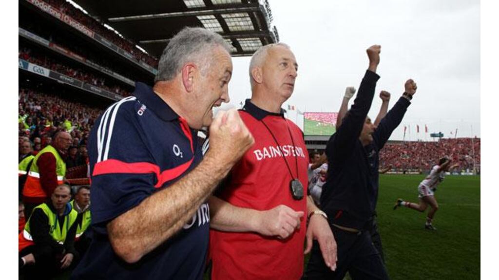 Conor Counihan is congratulated by selector Ger O’Sullivan at the end of last month’s All-Ireland final. Photograph: Cathal Noonan/Inpho