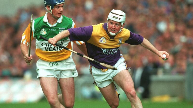Tom Dempsey in action against Offaly’s Hubert Rigney in the Leinster semi-final of 1997. Photograph: James Meehan/Inpho