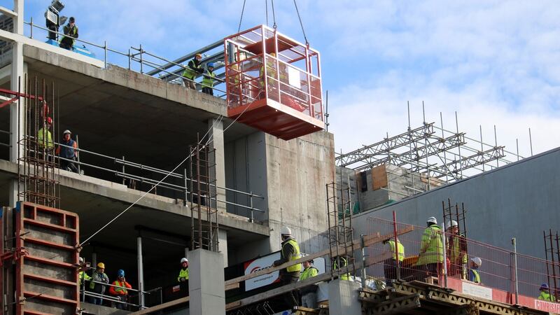A patient is lifted from a building in Henry Street, Limerick. Photograph: Brendan Gleeson