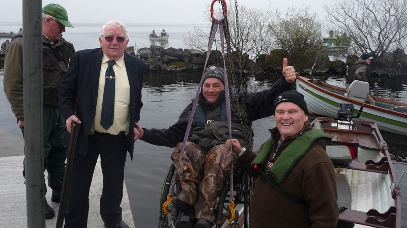 ‘Timo’ O’Sullivan about to be lowered on a new hoist, with Phil Horan, right, and Ciarán Burke ready with shotgun to start the competition
