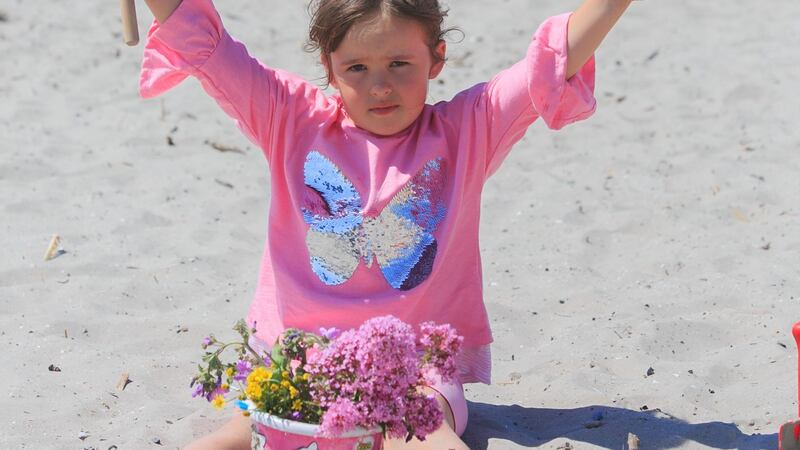 Lucia Pivarci (6) from Clontarf enjoying the good weather on Bull Island, Dublin. Photograph: Gareth Chaney/Collins