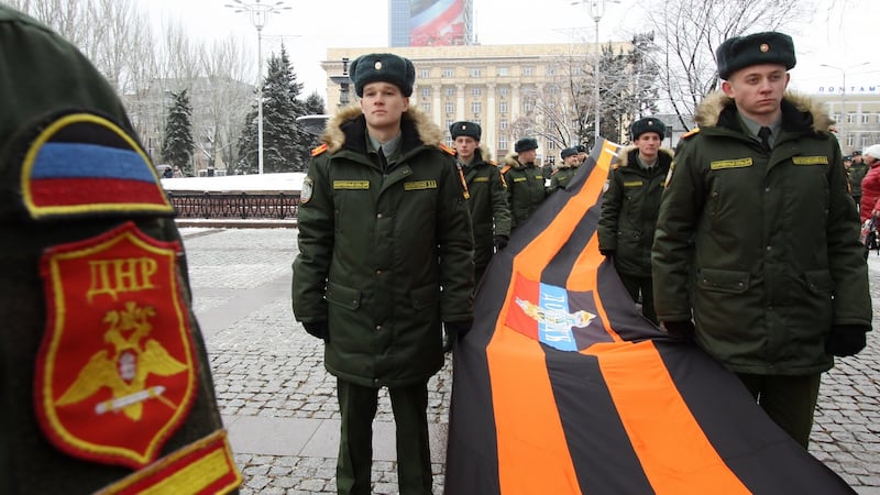 Servicemen during a celebration of Day of St George Ribbon in Donetsk’s central square. Shakhtar had to leave the city in 2014. Photo: Valentin Sprinchak/Getty Images