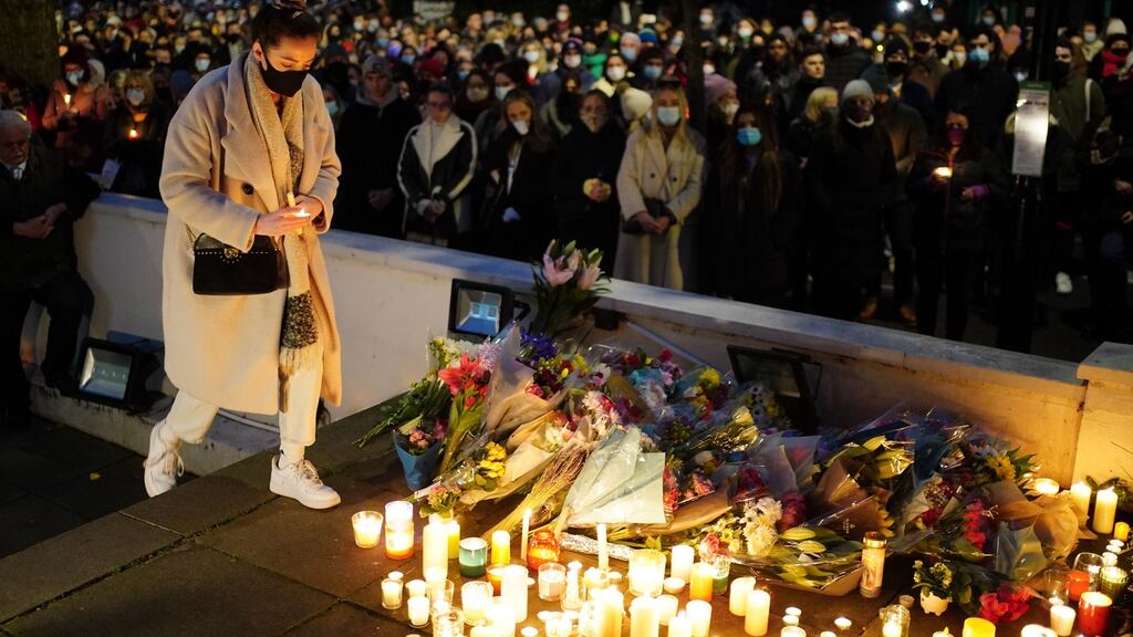 Floral tributes and candles are left after a vigil outside the London Irish Centre in Camden in memory of Ashling Murphy: There were no vigils in New York, London and Edinburgh for Jastine Valdez. Photograph: Dominic Lipinski/ PA Wire