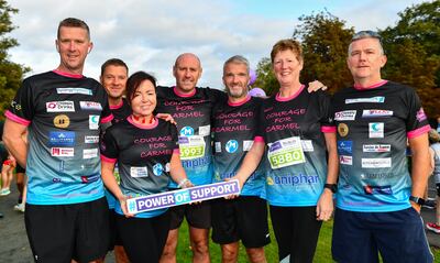 Janette Murphy and some of her 29 "Courage for Carmel" teammates. They are running as a tribute to their relative and friend Carmel Murray, who died of cancer earlier this year. Carmel gave a up a lot of time and energy raising money for charities, and they are trying to follow her example. Photograph: Sam Barnes/Sportsfile