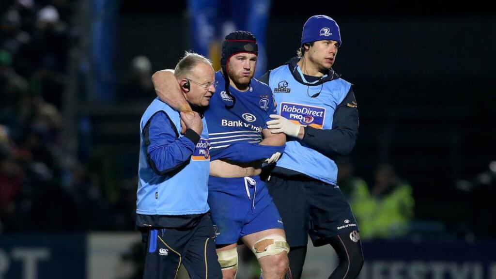 Leinster’s Sean O’Brien goes off having dislocated his shoulder in the second half. Photograph: Ryan Byrne/Inpho