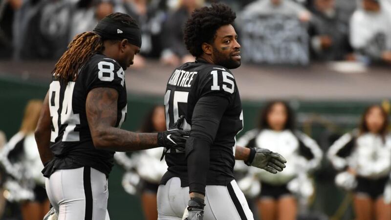 Michael Crabtree walks off the field after his clash with Aquib Talib. Photograph: Robert Reiners/Getty