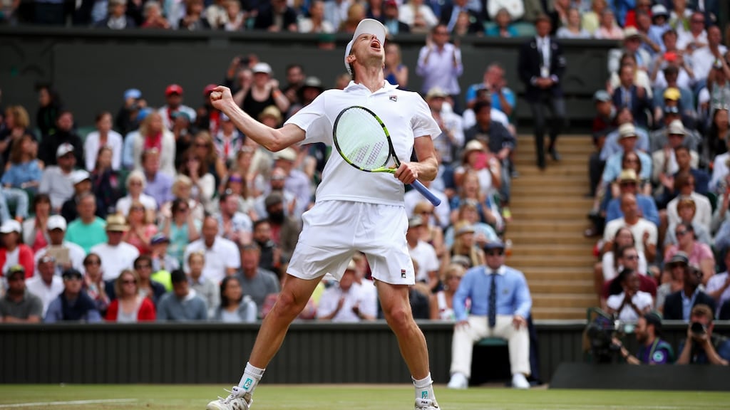 Sam Querrey celebrates after winning against Andy Murray on day nine of the Wimbledon Lawn Tennis Championships. Photo: Clive Brunskill/Getty Images