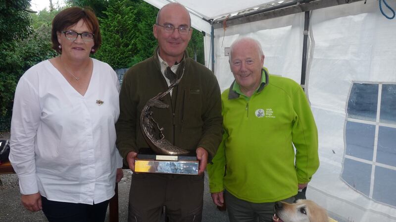 Autism competition organiser, Dorrie Gibbons, Mark Regan (winner) and John Downes (Irish Guide Dogs) with ‘Gallagher’.