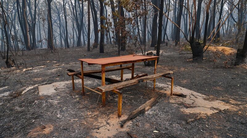 A burnt out picnic table in Wingello, Australia, on Sunday. Photograph: Brett Hemmings/Getty Images