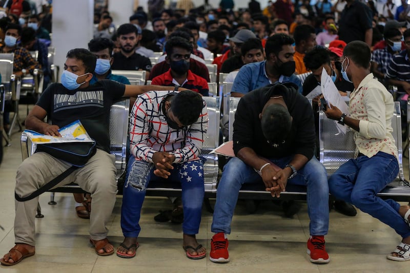 People wait to get their passports inside the Department of Immigration and Emigration amid the country's worst economic crisis, in Colombo, Sri Lanka, on Tuesday. Photograph: Chamila Karunarathne/EPA