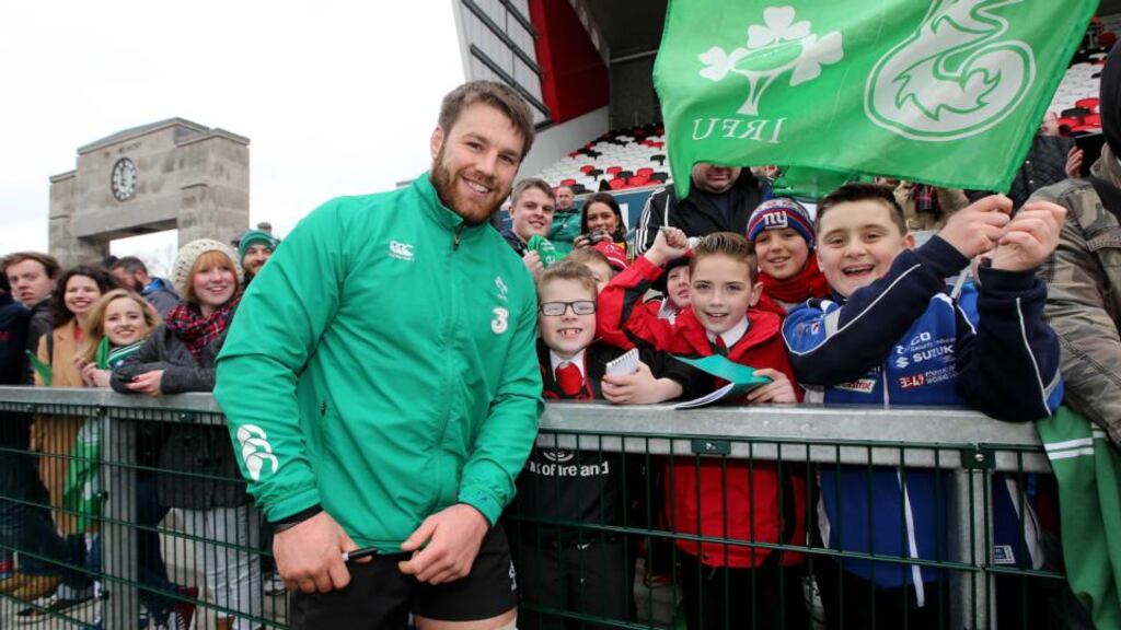 Seán O’Brien meets some happy fans at the Ireland rugby squad’s open training session in Belfast. Photograph: Ryan Byrne/Inpho