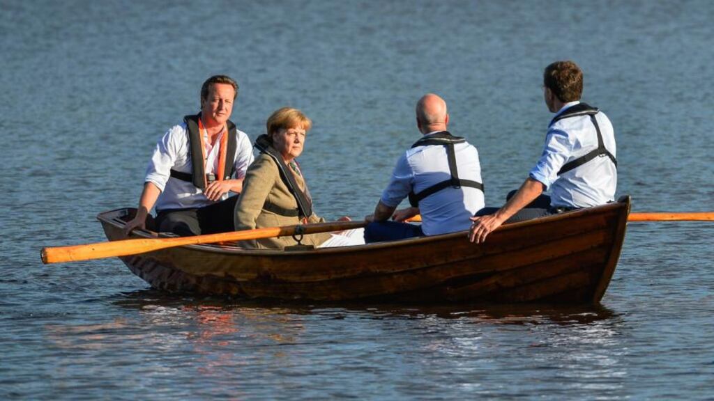 From left: British Prime Minister David Cameron, German Chancellor Angela Merkel, Swedish Prime Minister Fredrik Reinfeldt and Dutch Prime Minister Mark Rutte take a boat ride with Reinfeldt handling the oars in a lake at Reinfeldt’s summer residence Harpsund, south-west of Stockholm, Sweden. during an evening break in their talks on EU and the the new European Parliament.