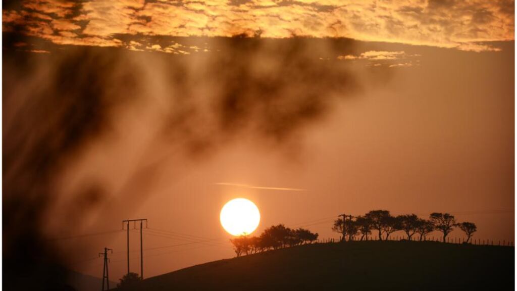Met Éireann’s latest monthly weather report revealed above average mean temperatures across the country. The sun rises over a hill just north of Donegal town on a warm day. Photograph: Bryan O’Brien/The Irish Times