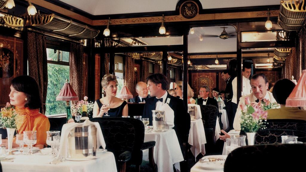 Passengers enjoying dinner in dining car ‘Etoile du Nord’ on the Orient Express.